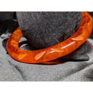 Vintage Translucent Orange Bakelite Bangle With Carved Leaf Design